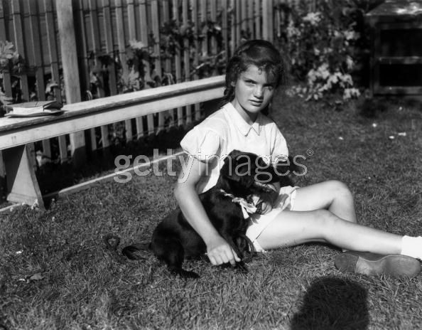 28th July 1939: EXCLUSIVE Jacqueline Bouvier (1929 - 1994) seated with her dog, Tammy, at the dog show at East Hampton Fair, Long Island, New York. It was her tenth birthday. The fair was held on the Village Green and benefits the LIVS. (Photo by Morgan Collection/Getty Images)